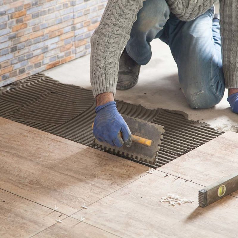 Laying floor ceramic tile. Renovating the floor